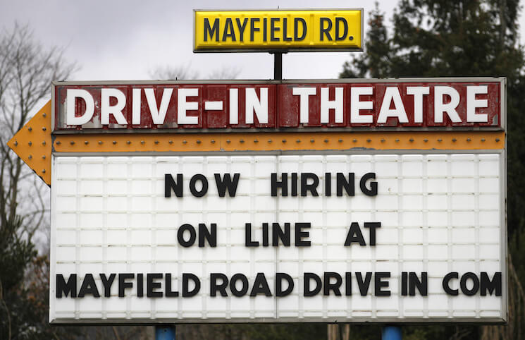 A help-wanted sign displays outside the Mayfield Drive-In movie theater in Chardon, Ohio. U.S. job growth slowed in January, with employers adding 151,000 jobs last month, compared to the 262,000 jobs added in December.