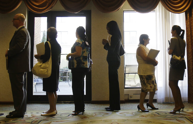 Job seekers stand in line to enter a job fair in Independence, Ohio. 