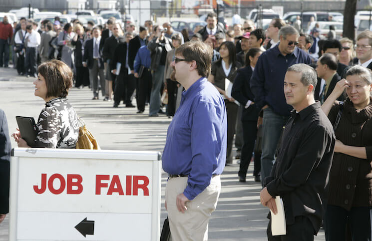 Hundreds of people wait in line at a job fair in San Mateo, California, Wednesday, February 25, 2009.