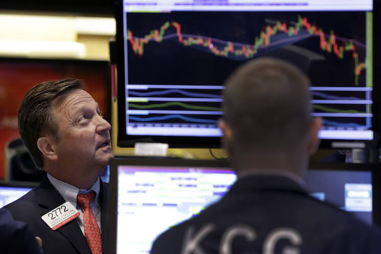 Two traders on the floor of the New York Stock Exchange. 