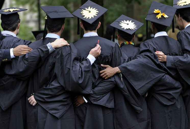Graduates pose for photographs during commencement at Yale University in New Haven, Conn.