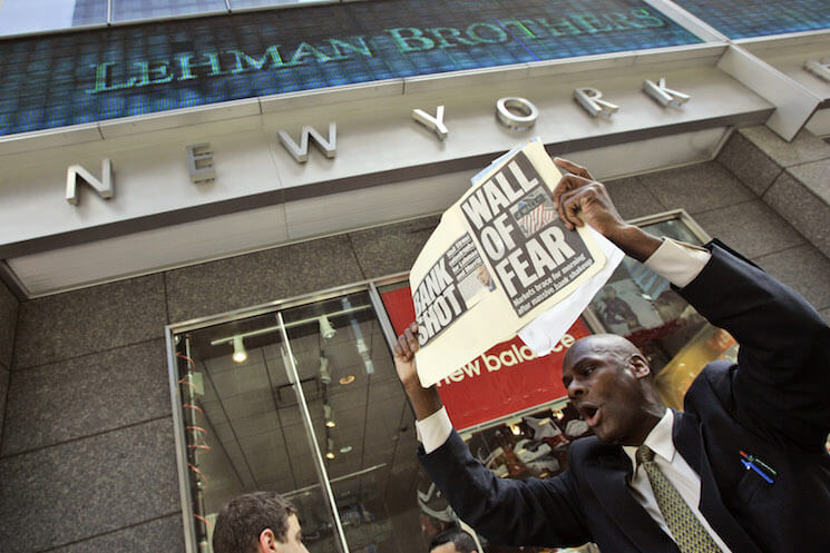 A man demonstrates outside the Lehman Brothers headquarters following the firm’s 2008 collapse.