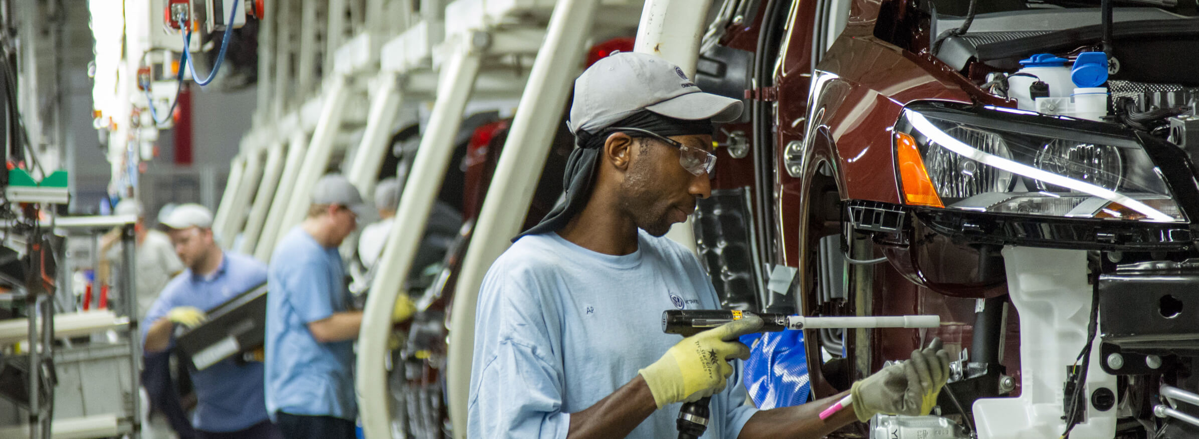 FILE - In this June 12, 2013, file photo, workers assemble Volkswagen Passat sedans at the German automaker's plant in Chattanooga, Tenn. AP Photo/ Erik Schelzig, file)