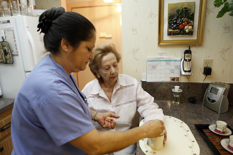 Home health aide Maria Fernandez, left, makes coffee for Herminia Vega, 83, right. Employment for home health aides is expected to grow 38 percent, much faster than average for all occupations. 