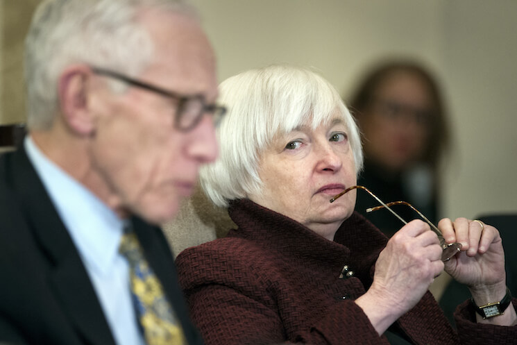 Federal Reserve Board Chair Janet Yellen listens as Vice Chair Stanley Fischer as he speaks during an open meeting in Washington, Thursday, Dec. 15, 2016. 