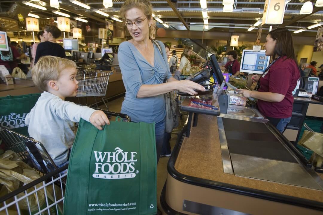 Customers shop for organic groceries at the Whole Foods Market Arroyo Parkway store in Pasadena, California. 