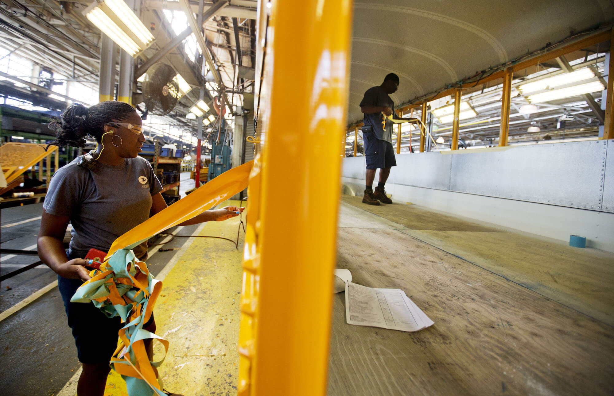 Employees work on a school bus on the assembly line at Blue Bird Corporation’s manufacturing facility in Fort Valley, Ga. (AP Photo/David Goldman)