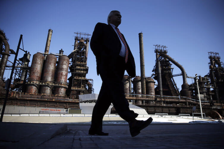 A man walks past the former Bethlehem Steel in Bethlehem, Pa. 