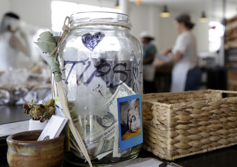 A tip jar sits on the counter at Zak the Baker in Miami.