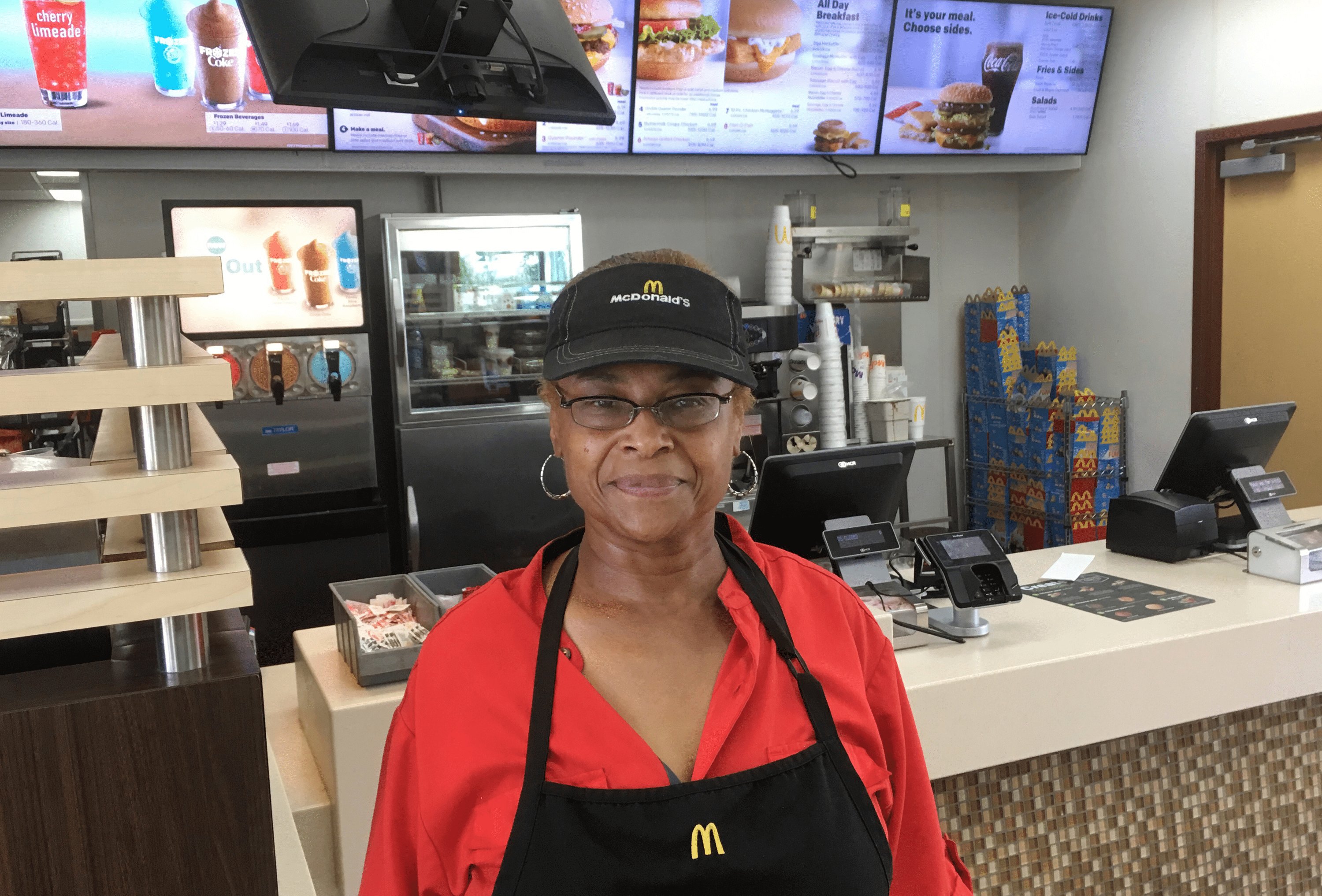 Bettie Douglas, a 59-year-old mother of three, stands inside the McDonald's she works in St. Louis.