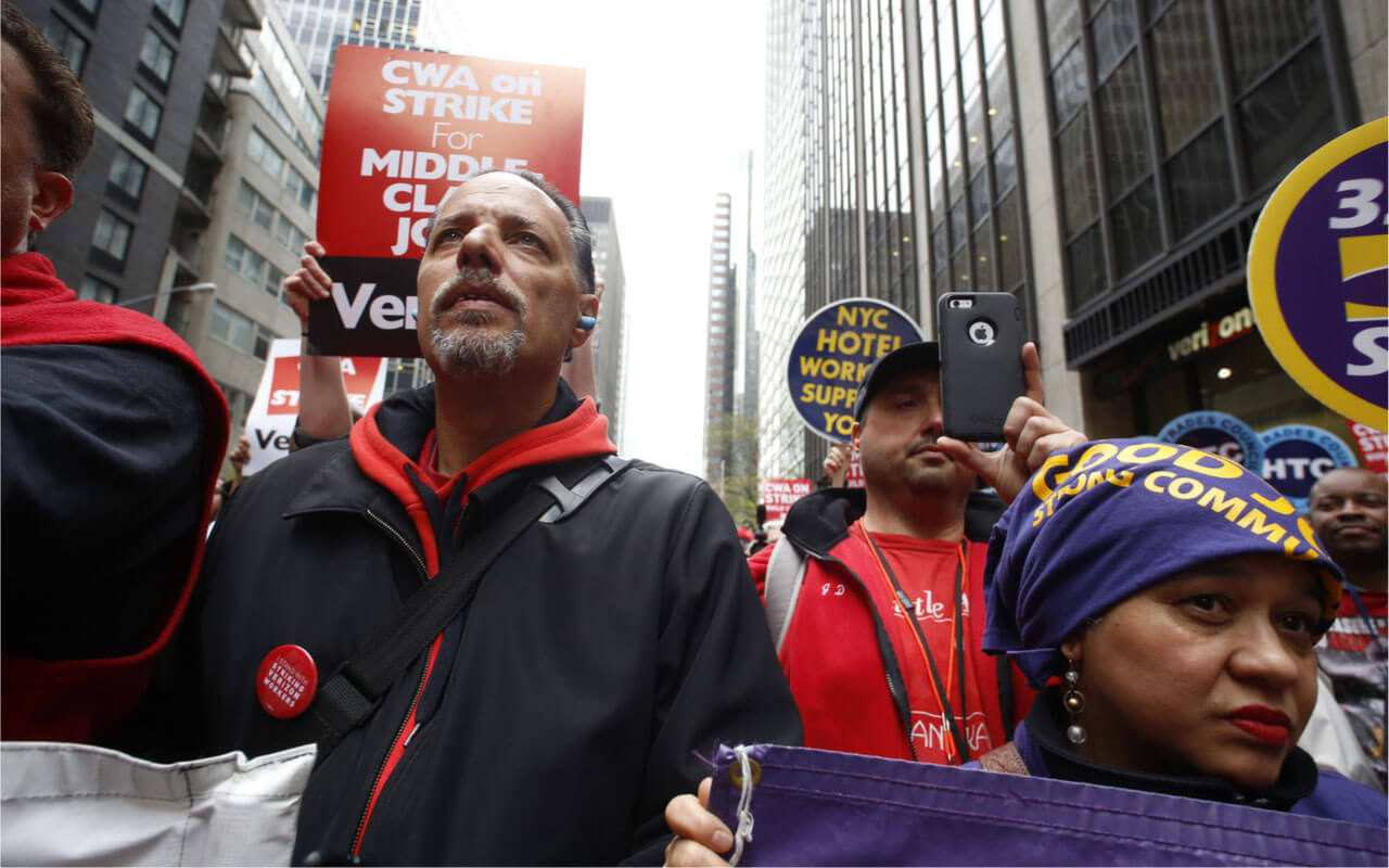 NEW YORK CITY - MAY 5 2016: Striking Verizon workers gathered with members of other unions and labor leaders in front of Verizon's Wall St headquarters.